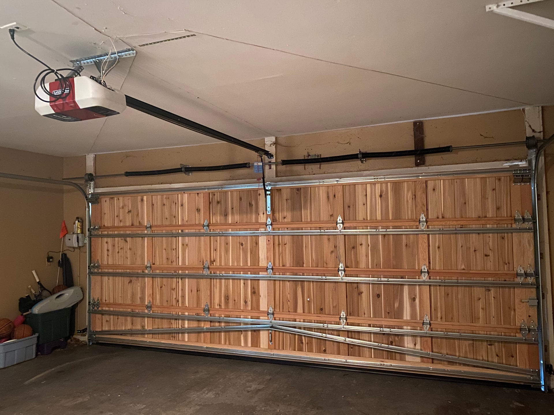 Interior garage door tracks and hardware